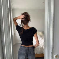 - Camiseta de manga corta