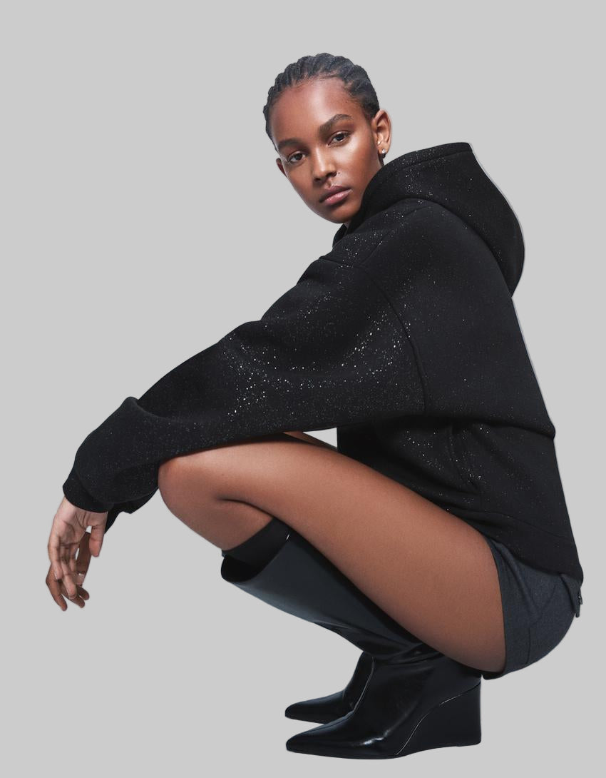 - Sudadera con capucha de purpurina