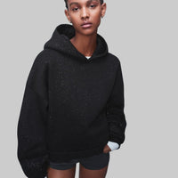 - Sudadera con capucha de purpurina